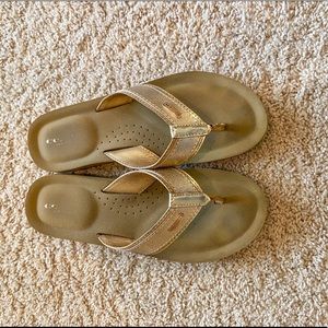 Gold Coach flip flops